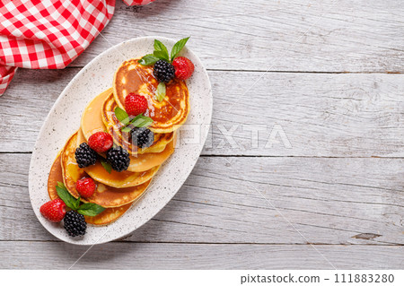 Tasty homemade pancakes with berries 111883280