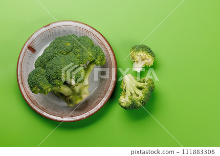 Fresh broccoli head with vibrant green color Fresh broccoli head with vibrant green color 111883308