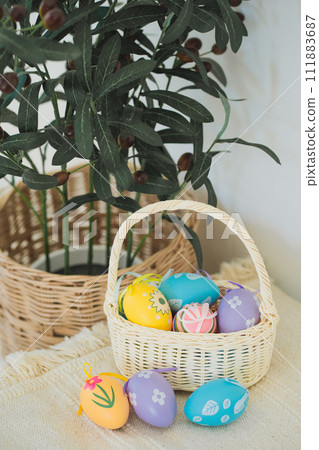 easter holiday concept with colorful egg and put in basket with tree and white background 111883687