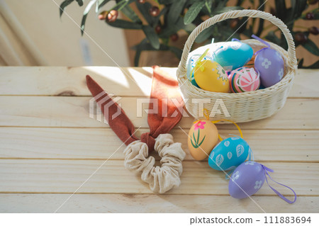 easter holiday concept with colorful egg and put in basket and put on wood table easter holiday concept with colorful egg and put in basket and put on wood table 111883694