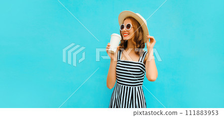 Portrait of happy smiling young woman drinking fresh juice or coffee in summer straw hat, dress 111883953