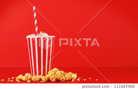 Paper cup with cola and ice over red background 111883980