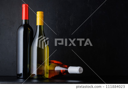Various wine bottles over black Various wine bottles over black 111884023