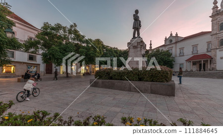 Panorama showing Sa da Bandeira Square with a view of the Santarem See Cathedral day to night timelapse. Portugal Panorama showing Sa da Bandeira Square with a view of the Santarem See Cathedral day to night timelapse. Portugal 111884645