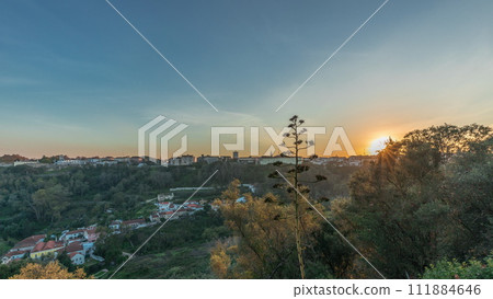 Panorama showing sunset over the Castle of Almourol on hill in Santarem aerial timelapse. Portugal Panorama showing sunset over the Castle of Almourol on hill in Santarem aerial timelapse. Portugal 111884646