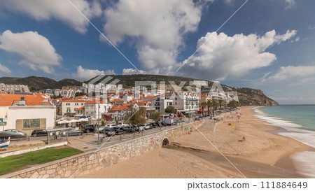 Panorama showing aerial view of Sesimbra Town and seaside timelapse, Portugal. Panorama showing aerial view of Sesimbra Town and seaside timelapse, Portugal. 111884649