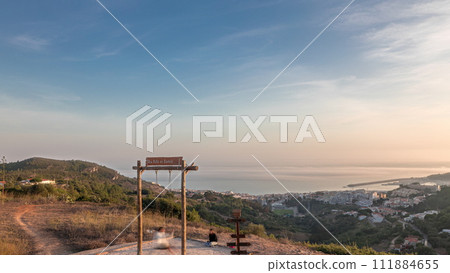 Panorama showing aerial View of Sesimbra Town and Port during sunset timelapse, Portugal. Panorama showing aerial View of Sesimbra Town and Port during sunset timelapse, Portugal. 111884655