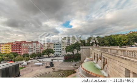 Panorama showing aerial view of Jardim da Alameda in Lisbon with the Luminous Fountain timelapse during sunset. Panorama showing aerial view of Jardim da Alameda in Lisbon with the Luminous Fountain timelapse during sunset. 111884666
