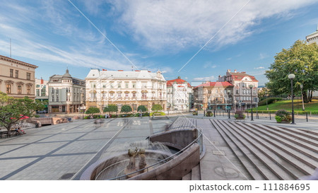Panorama showing Sulkowski Castle and fountain on Chrobry Square in Bielsko-Biala timelapse, Poland. Panorama showing Sulkowski Castle and fountain on Chrobry Square in Bielsko-Biala timelapse, Poland. 111884695