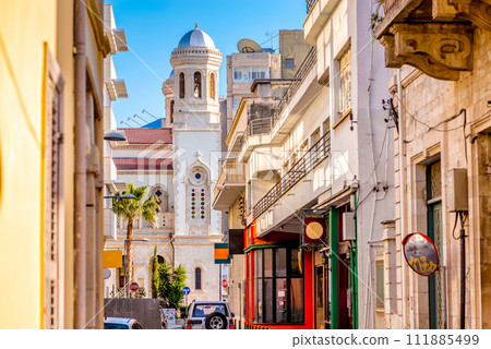 View of Ayia Napa Church through a street in the old town. Limassol, Cyprus View of Ayia Napa Church through a street in the old town. Limassol, Cyprus 111885499