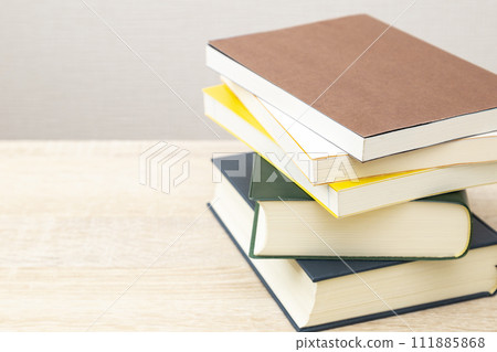 books piled on the desk books piled on the desk 111885868