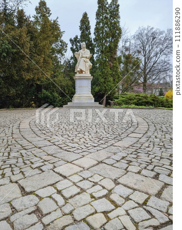 Marble statue of the austrian poet and writer Robert Hamerling sitting in a chair in the city park Stadtpark, in Graz, Steiermark region, Austria. Selective focus Marble statue of the austrian poet and writer Robert Hamerling sitting in a chair in the city park Stadtpark, in Graz, Steiermark region, Austria. Selective focus 111886290
