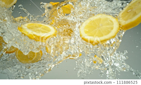 Freeze Motion of Flying Slices of Lemons with Splashing Water. Freeze Motion of Flying Slices of Lemons with Splashing Water. 111886525