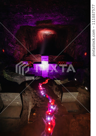 Magnificent cross glows with spiritual light in famous underground Catedral de Sal (Salt Cathedral) of Zipaquira, Colombia 111887577