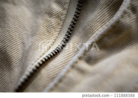 Zipper for pants. Denim fabric close-up, distinct texture 111888388