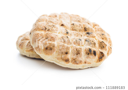 Arabic flat pita bread isolated on white background. 111889183