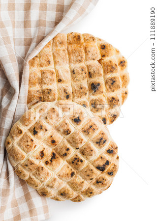 Arabic flat pita bread isolated on white background. Arabic flat pita bread isolated on white background. 111889190