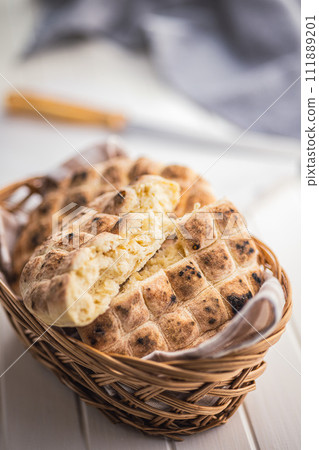 Arabic flat pita bread in basket on white table. 111889201