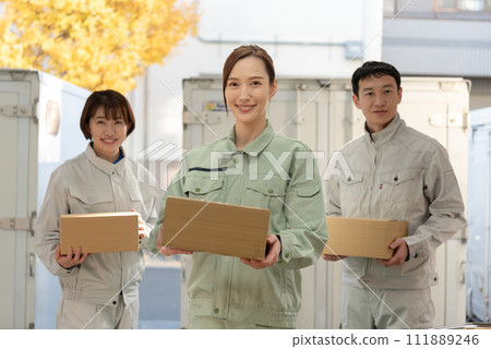 Men and women in work clothes carrying luggage 111889246