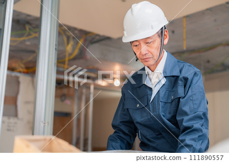 A carpenter working at a workbench 111890557