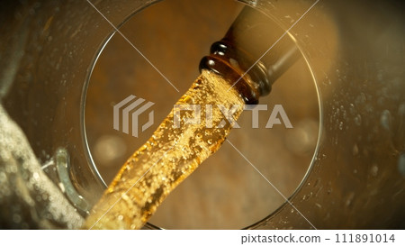 Macro Shot of Beer Pouring into Glass. Macro Shot of Beer Pouring into Glass. 111891014