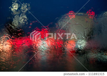 Abstract Rain-Distorted Lights on Car Windshield Abstract Rain-Distorted Lights on Car Windshield 111891315