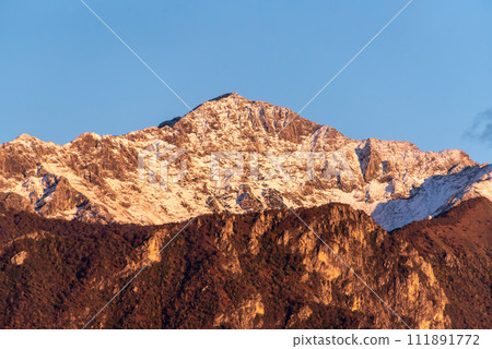 Snowcapped mount Grignetta at lake Como in Italy 111891772