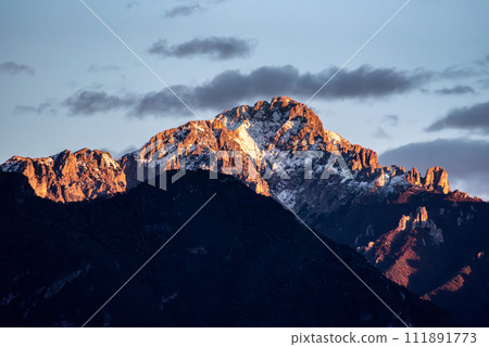 Sunset at snowcapped mount Grigna at lake Como Sunset at snowcapped mount Grigna at lake Como 111891773