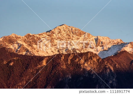 Snowcapped mount Grignetta at lake Como in Italy Snowcapped mount Grignetta at lake Como in Italy 111891774
