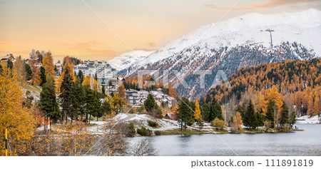 St. Moritz and lake in autumn, surrounded by snowcapped mountains St. Moritz and lake in autumn, surrounded by snowcapped mountains 111891819