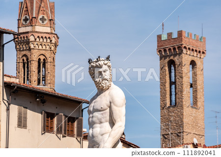Statue of the famous Neptune fountain at the Piazza della Signoria in Florence 111892041