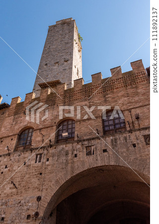 Main square Piazza del Duomo in San Gimignano with its famous palace towers, Rognosa tower and Theater dei Leggieri in the center Main square Piazza del Duomo in San Gimignano with its famous palace towers, Rognosa tower and Theater dei Leggieri in the center 111892137
