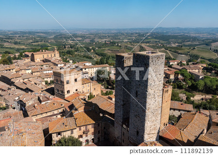 Wide panoramic view over downtown San Gimignano, Torri dei Salvucci in the center, seen from Torre Grosso 111892139