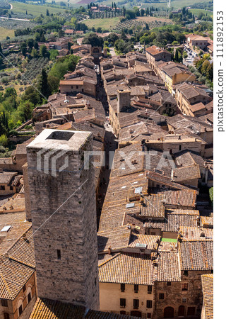 Wide panoramic view over downtown San Gimignano, Torre Ficarelli in the center, seen from Torre Grosso 111892153