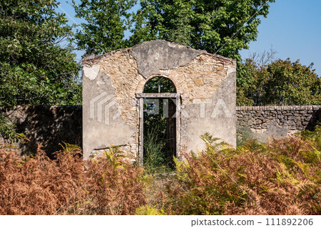 A small derelict cemetery near the Cellole monastery in the beautiful landscape of the Tuscany 111892206