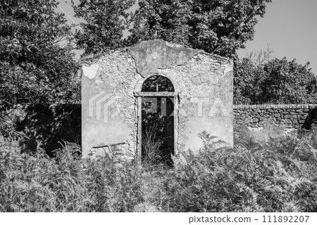 A small derelict cemetery near the Cellole monastery in the beautiful landscape of the Tuscany 111892207