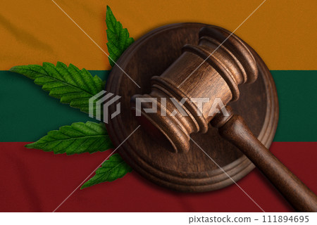 Justice wooden gavel with cannabis leaf on the Flag of Lithuania. Illegal growth of cannabis plant and drugs spreading Justice wooden gavel with cannabis leaf on the Flag of Lithuania. Illegal growth of cannabis plant and drugs spreading 111894695