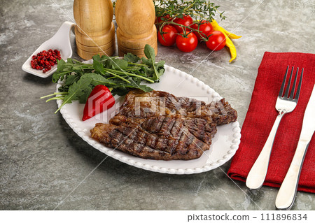 Grilled chuck roll steak with arugula 111896834