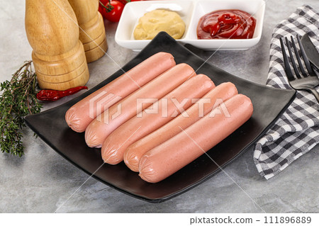 Boiled sausages with ketchup and mustard 111896889