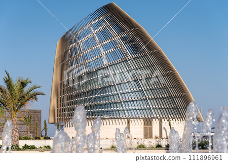 Curved abstract architectural building in Ayia Napa marina. Famagusta District, Cyprus Curved abstract architectural building in Ayia Napa marina. Famagusta District, Cyprus 111896961