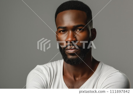 Portrait of young hadsome serious bearded African American man on grey background with copy space 111897842