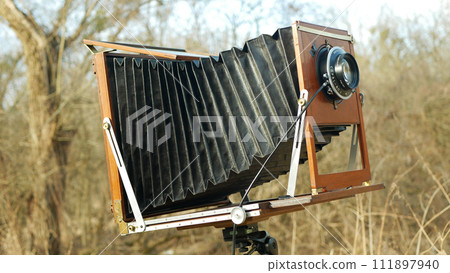 Large format vintage camera details closeups, wooden large format 24X30 tilt shift focusing moving focus lens, 120 years old technology, historical museum specimen, rare professional collection 111897940