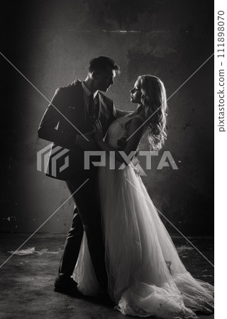 Art fashion studio photo of wedding couple silhouette groom and bride on colors background. 111898070