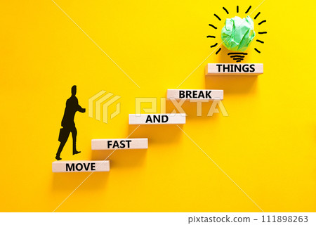 Move fast and break things symbol. Concept words Move fast and break things on wooden blocks. Beautiful yellow background. Businessman icon. Business, move fast and break things concept. Copy space. Move fast and break things symbol. Concept words Move fast and break things on wooden blocks. Beautiful yellow background. Businessman icon. Business, move fast and break things concept. Copy space. 111898263