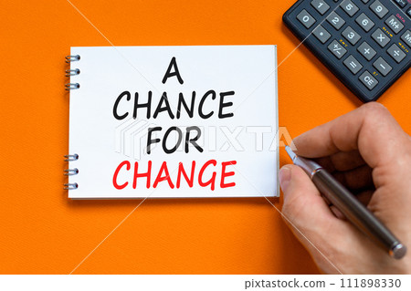 A chance for change symbol. Concept words A chance for change on beautiful white note. Beautiful orange background. Voter hand. Calculator. Business A chance for change concept. Copy space. A chance for change symbol. Concept words A chance for change on beautiful white note. Beautiful orange background. Voter hand. Calculator. Business A chance for change concept. Copy space. 111898330