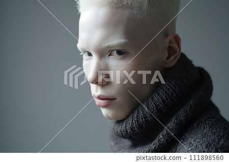 Authentic handsome man with fair skin and white hair on a grey background Authentic handsome man with fair skin and white hair on a grey background 111898560