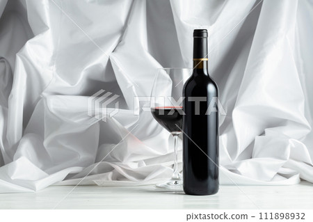 Red wine on a white wooden tfble. Red wine on a white wooden tfble. 111898932