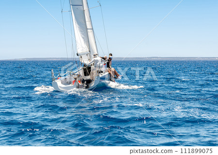 Sailing crew on sailboat during yacht regatta 111899075