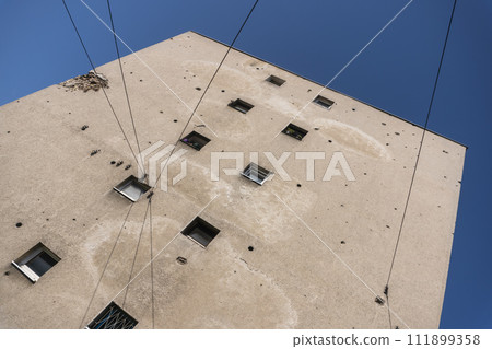 Bullet holes in a house after shooting, bombing and shelling during the War in Sarajevo, Bosnia and Herzegovina Bullet holes in a house after shooting, bombing and shelling during the War in Sarajevo, Bosnia and Herzegovina 111899358