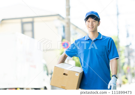 A courier male driver delivering a package A courier male driver delivering a package 111899473